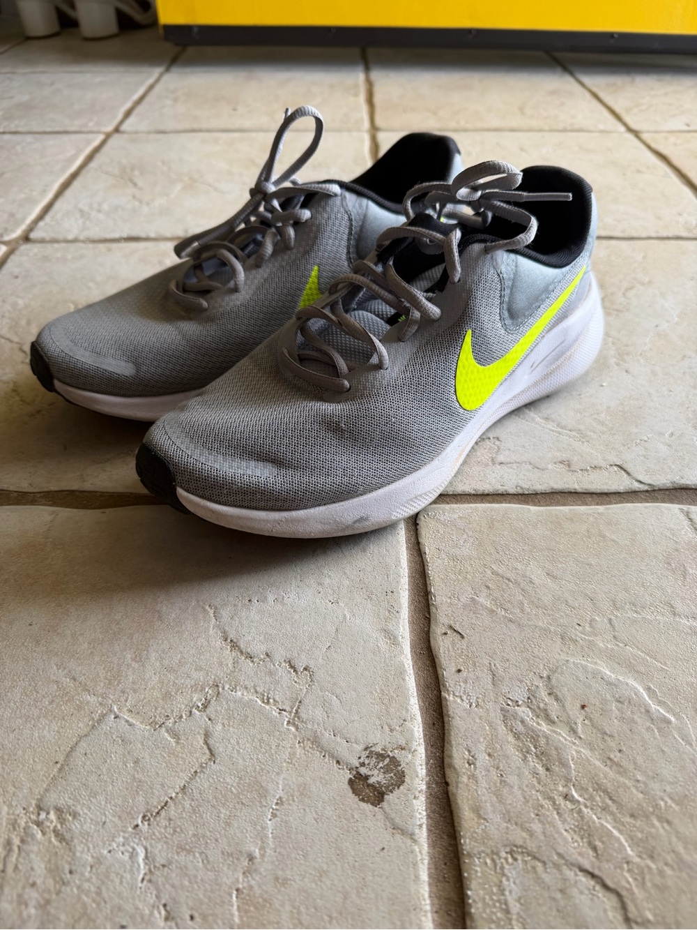 Nike Grey Athletic Sneakers with Neon Yellow Swoosh